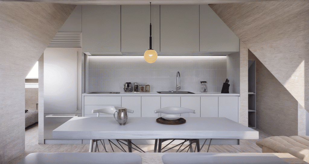 Vista frontal de cocina en buhardilla reformada con muebles empotrados y diseño minimalista.